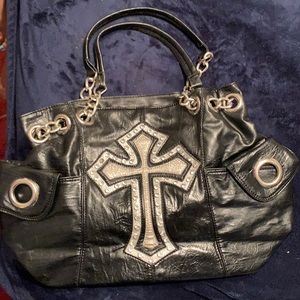 Black purse with rhinestone details.